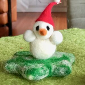 Kleiner Schneemann auf Stern